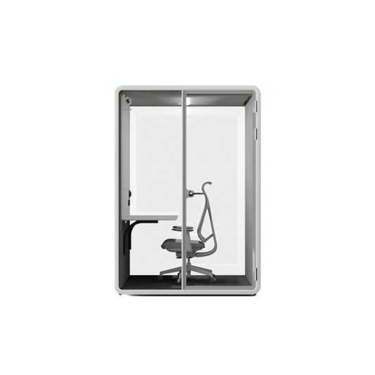 A modern glass privacy booth with a gray frame, featuring a built-in desk on the left side and a gray office chair inside, shown against a plain white background.