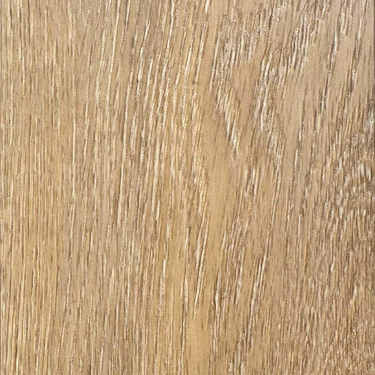 Close-up of a wooden surface with a light brown color and visible grain pattern.