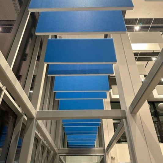 MuffleTone Colour Bleu hanging in a baffle configuration. 