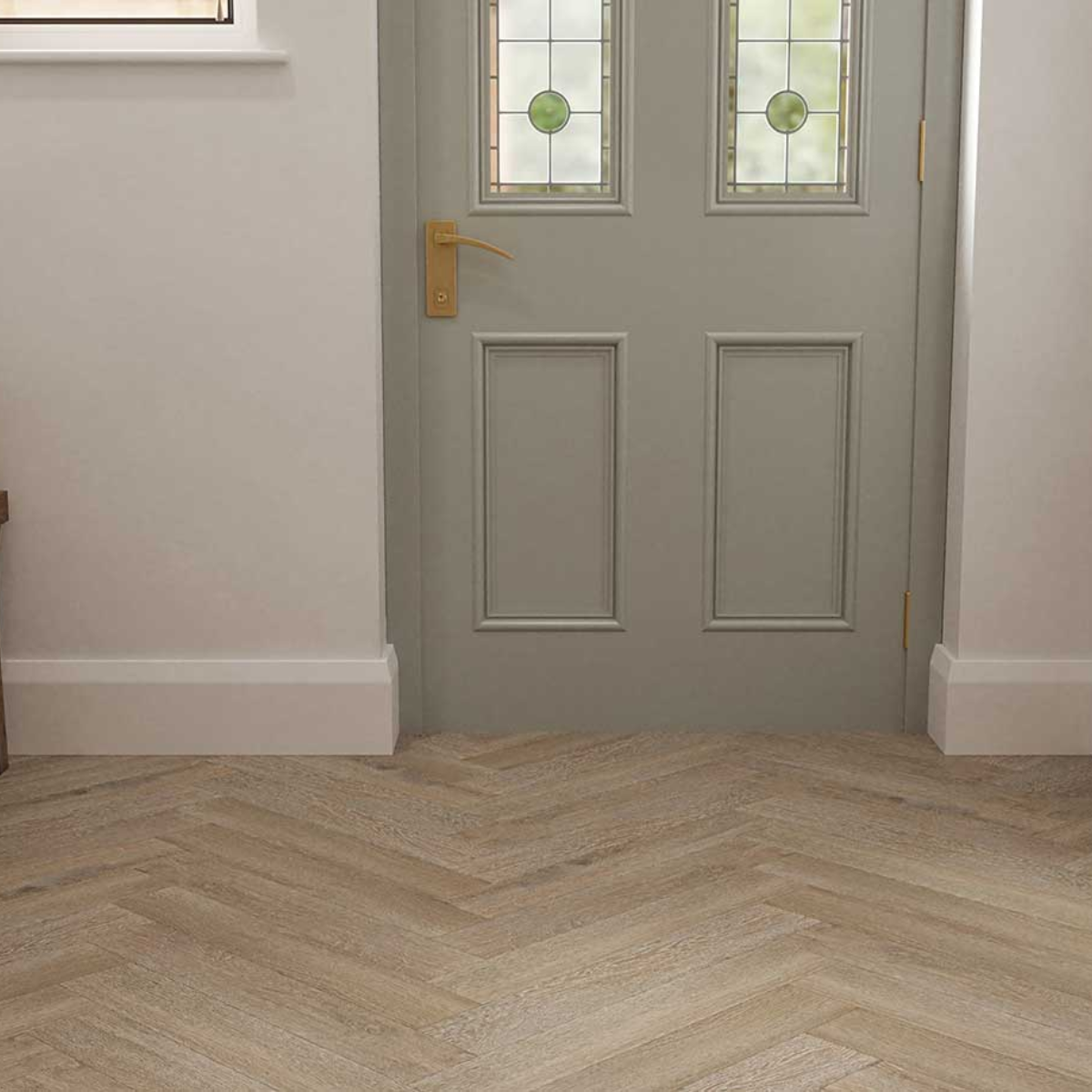 Gray front door with glass panels and a gold handle, featuring a herringbone wood floor.