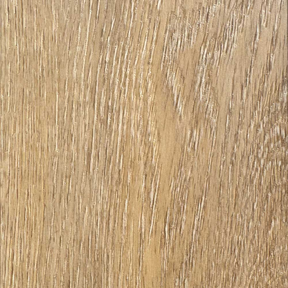 Close-up of a wooden surface with a light brown color and visible grain pattern.