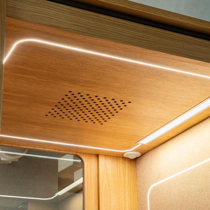 Wooden panel on the pod's inside, with a ventilation grill and LED strip lighting